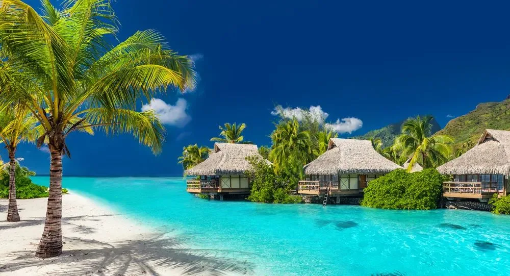 Overwater bungalows in a turquoise lagoon